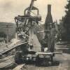 Old cement mixer pours cement during work on Third Street drainage ditch at Magnolia Avenue before 1940 in South Pittsburg, Tennessee. This ditch was covered to open or widen Third Street to town. Courtesy, Gail Golliher